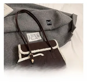 Detailed view of brown retro underarm bag with white fleece trim and mini coin purse
