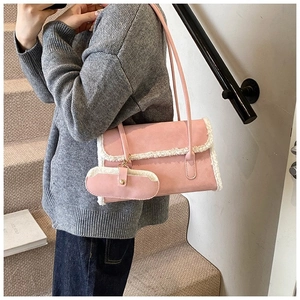 Pink faux leather shoulder bag with white faux fur trim and small matching pouch