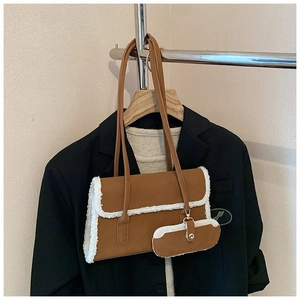Brown suede underarm bag with white faux fur trim and detachable mini coin purse