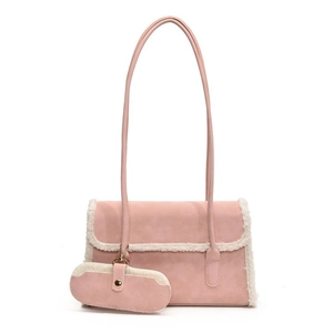 Pink suede shoulder bag with white faux fur trim and matching small oval coin purse