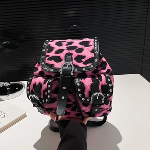 Pink and black leopard print backpack with silver rivet studs and flap pockets