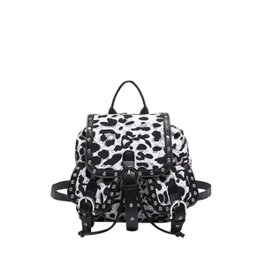Leopard print mini backpack with silver rivets and punk style leather trim on white background