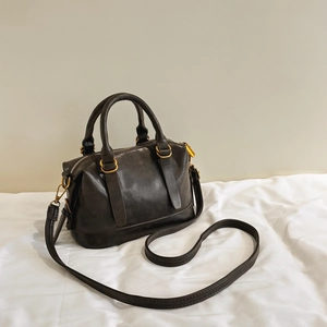 Classic dark brown matte Boston bowling bag with dual handles and adjustable shoulder strap