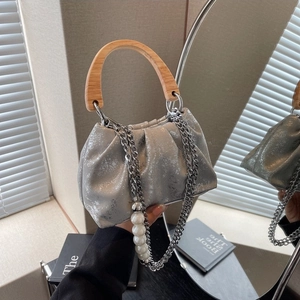 Silver pleated cloud bag with wooden handle and oversized pearl chain strap detail