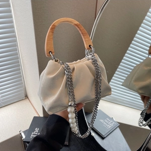 Chic ruched cloud bag with wooden handle, pearl chain detail, and a minimalist ivory design