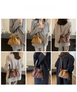 Detailed model views of leopard print and solid suede drawstring bucket bags with tassels