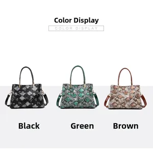 Three snake-pattern tote bags in black, green, and brown with gold hardware accents