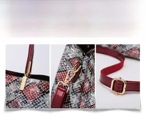 Detail of burgundy glossy leather strap with adjustable gold buckle on snakeskin tote bag
