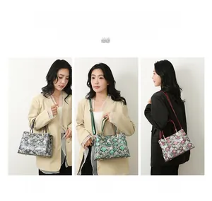 Detailed view of snake skin texture tote bags in blue, green and dark red finishes