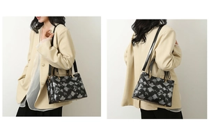 Detail of snakeskin pattern tote bag with silver geometric textures and crossbody strap