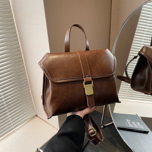 Retro dark brown crossbody briefcase bag with adjustable strap and vintage hardware