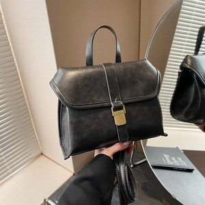 Vintage black leather briefcase bag with gold buckle and adjustable crossbody strap
