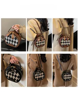 Detailed views of a round checkered shoulder bag with gold hardware and leather handles