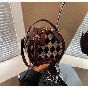 Retro circular argyle shoulder bag with top handle and gold hardware in dark brown finish