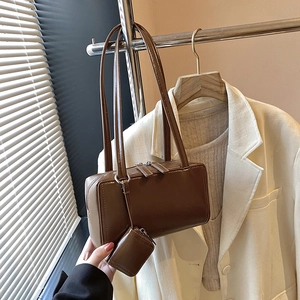 Minimalist vintage brown shoulder bag with a matching small coin pouch and silver hardware