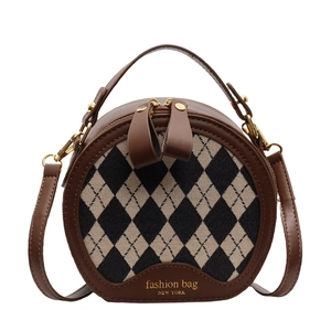 Classic round plaid crossbody bag with brown leather trim and fashion gold lettering