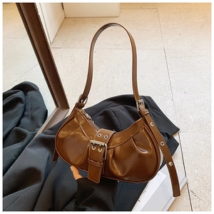 Vintage brown glossy leather crescent bag with adjustable buckle and silver hardware