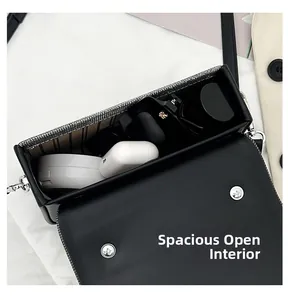 Top view of compact crossbody bag interior showing large capacity for essentials