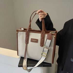 Retro canvas and brown leather tote bag with wide strap and fashion leather tag