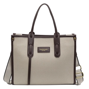 Large capacity canvas tote bag with brown leather trim and adjustable crossbody strap