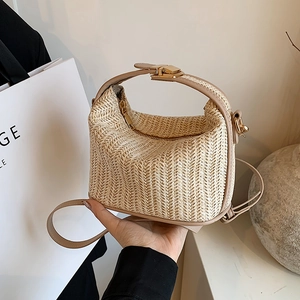 Chic light brown straw handbag with leather straps and gold metal lock for summer