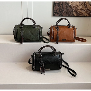 Retro Boston bags in green, black, and brown with metallic tassel and leather texture