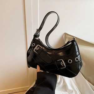 Retro black patent leather underarm bag with punk silver buckles and Y2K aesthetic design