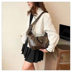 Vintage dark brown crescent shoulder bag in glossy faux leather with gold hardware