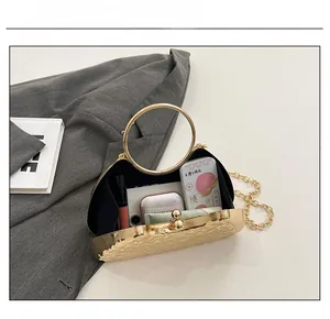 Interior view showing the storage capacity for essentials in this gold metallic evening bag