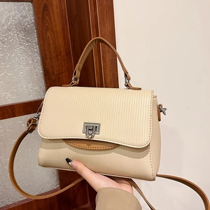 Chic cream pleated handbag for women with brown trim and adjustable shoulder strap