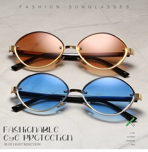 Detail of vintage oval metal sunglasses with blue light rejection and colored lenses