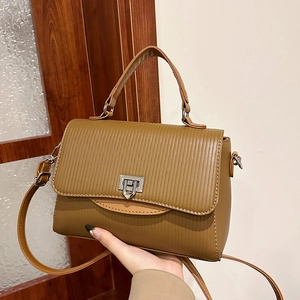Brown handbag with vertical striped texture and silver metal lock for women