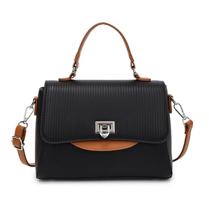 Fashionable black striped handbag with brown trim and a silver square metal rotary lock