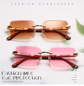 Detail view of rimless gradient sunglasses with wooden texture temples and golden metal hinges