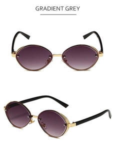 Detail view of gold metal oval sunglasses with gradient grey lenses and textured frames