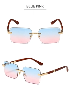 Detail view of rimless sunglasses with blue-pink gradient lenses and wood grain temples
