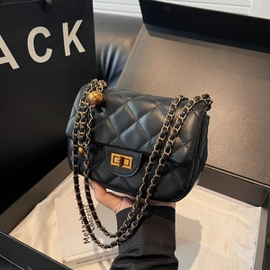 Quilted black leather crossbody bag with gold chain strap and spherical adjuster charm