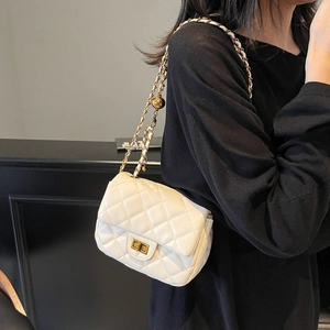 Elegant white quilted crossbody bag with gold chain strap and turn-lock closure
