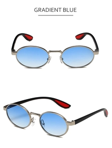 Detail of oval metal sunglasses with gradient blue lenses and red temple accents