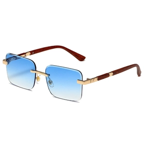 Rimless gradient blue sunglasses with golden metal bridge and brown wood grain temples