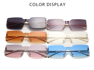 Detail showing six colorful rimless square sunglasses with elegant gold metal temples