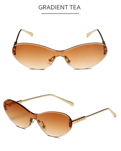 Makro-Detail einer randlosen Sonnenbrille in Verlaufsbraun mit goldenen Metallbügeln