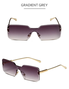 Detail of rimless rectangle sunglasses with gradient grey lenses and gold metal temples