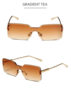 Detail of gradient tea lenses and gold metal temples on rimless square sunglasses