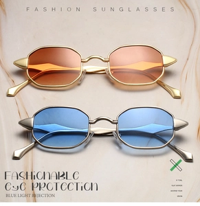 Detail of octagonal metal sunglasses with spiked hinges and gradient tinted lenses