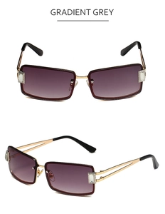 Detail of gradient grey lenses with rectangular metal frame and rhinestone accents