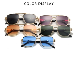 Detail view of navigator sunglasses in five lens colors with gold metal frames