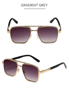 Detail of pilot sunglasses featuring gradient grey lenses and golden metal frame