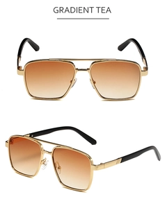 Detail view of gold metal aviator sunglasses with gradient tea lenses and double bridge