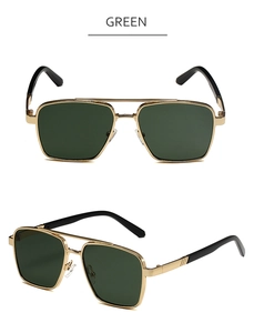 Detail of green lens aviator sunglasses with golden metal frame and double bridge